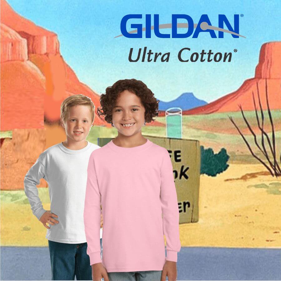 Two children modeling Gildan Ultra Cotton long sleeve T-shirts in white and pink, standing against a desert-themed background with red rock formations and blue sky.