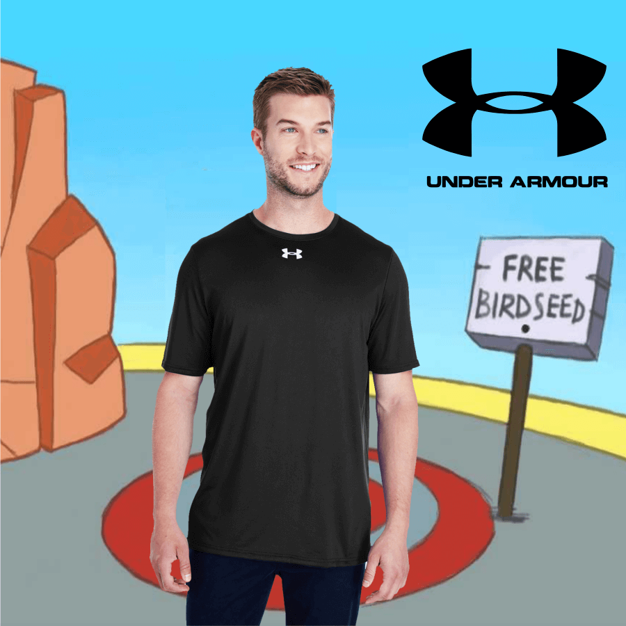 Smiling man wearing a black Under Armour short-sleeve performance t-shirt with logo on chest against a cartoon desert background