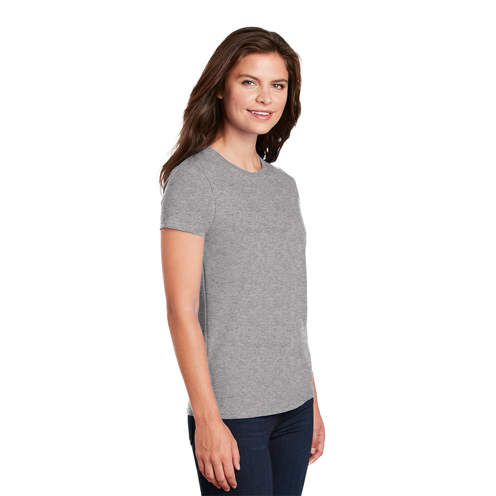 2000L_sport grey_model_3q Smiling woman with long brown hair wearing a plain gray short-sleeve t-shirt and dark jeans standing against a white background.