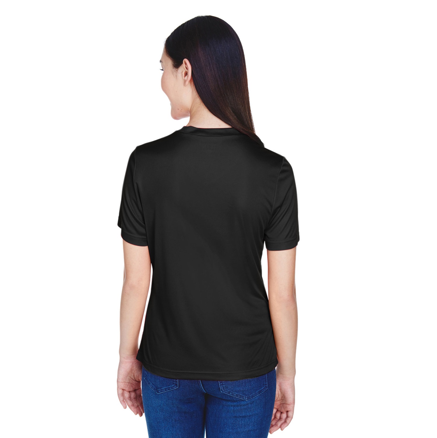 A woman wearing a black short-sleeve shirt, viewed from the back, showcasing a casual and stylish look. The shirt features a smooth fabric texture, ideal for everyday wear or athletic activities.