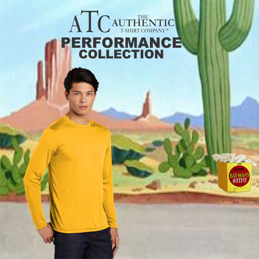 Young man wearing a yellow long-sleeve performance T-shirt from The Authentic T-Shirt Company's Performance Collection, standing in a cartoon desert background with cacti and rock formations.