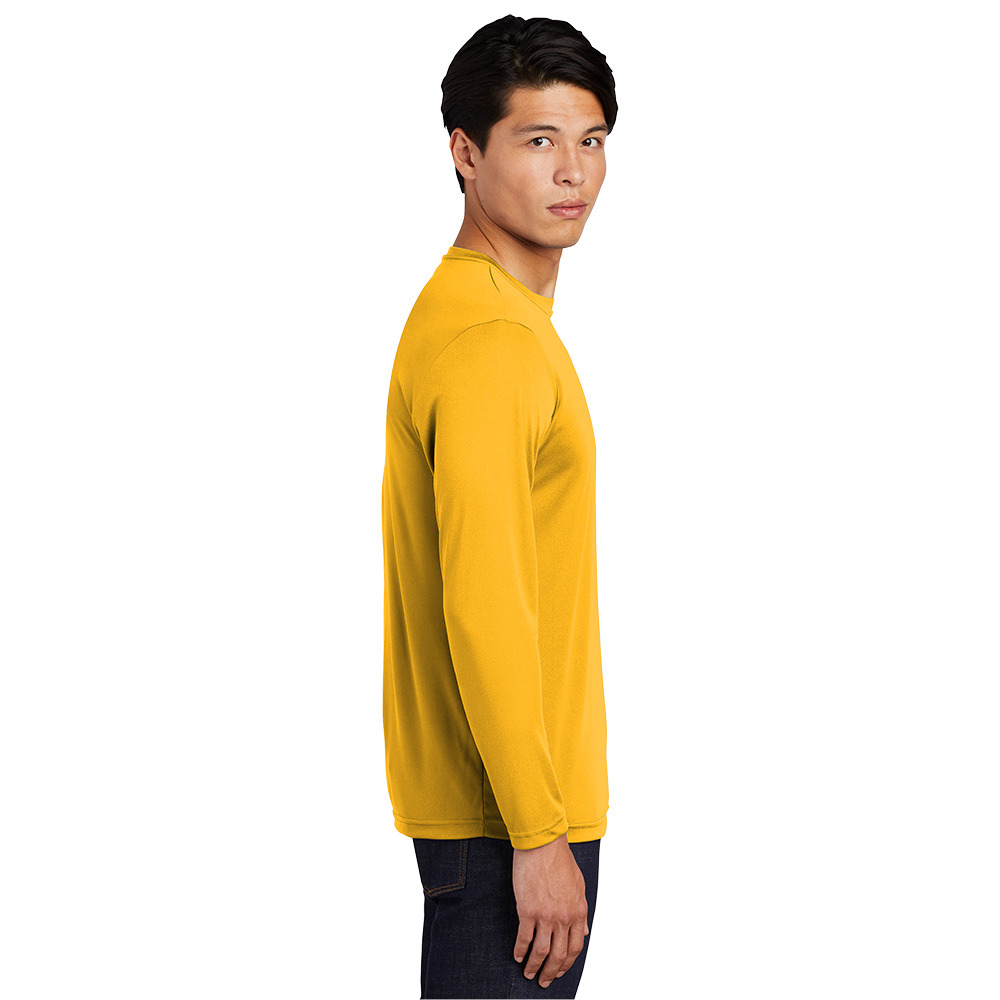Side view of a man wearing a mustard yellow long-sleeve crew neck shirt and dark jeans against a white background