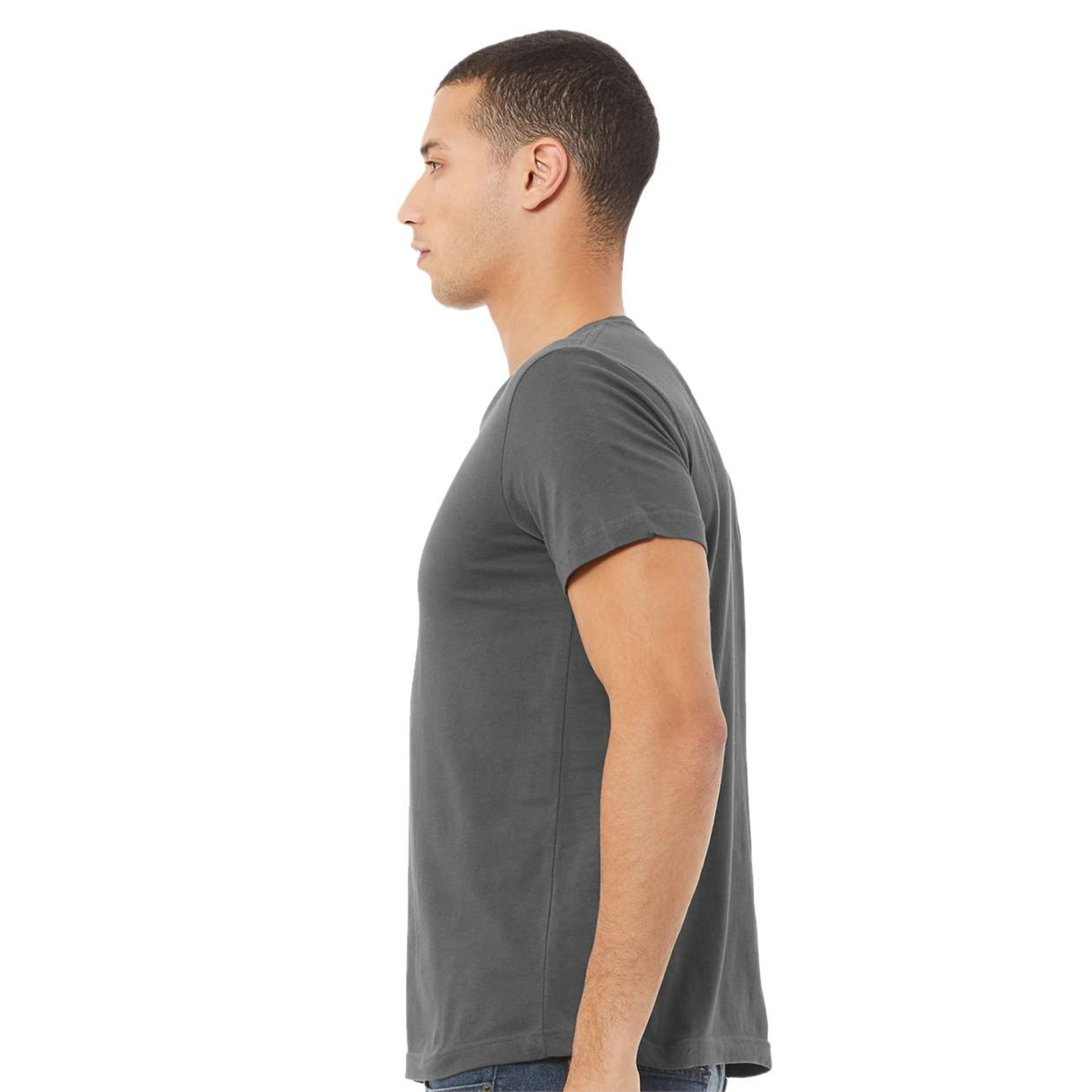 Side view of a man wearing a plain dark gray short-sleeve t-shirt and blue jeans against a white background