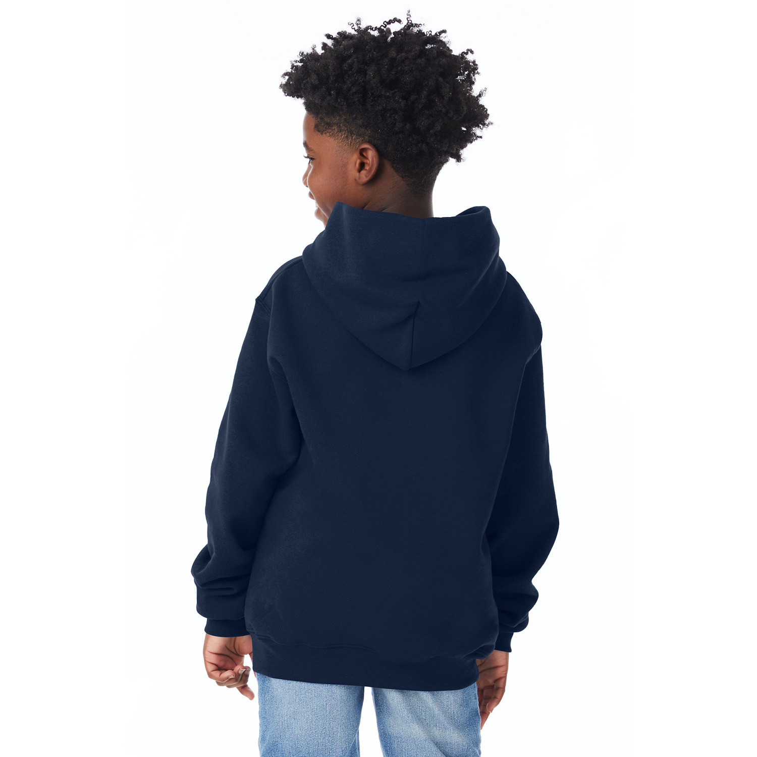 Child with curly hair wearing a navy blue hoodie and light blue jeans, facing away against a white background.