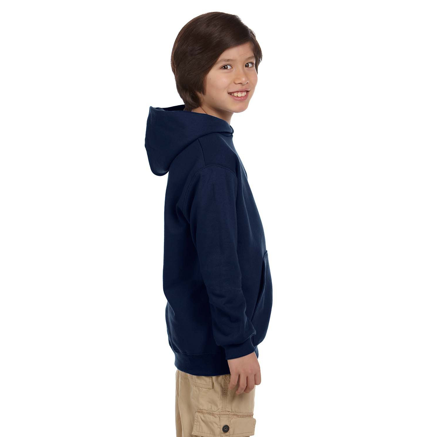 Smiling boy with brown hair wearing a navy blue hoodie and beige cargo shorts, standing sideways against a white background.