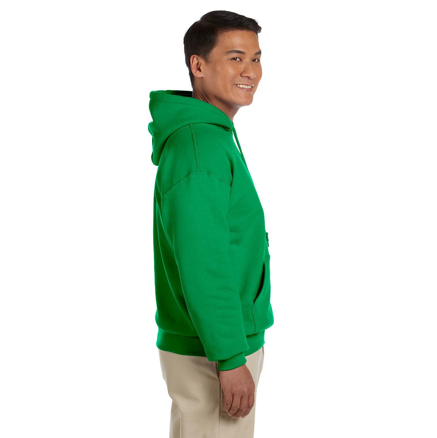 gildan_18500_cover_side Smiling man in beige pants wearing a bright green hooded sweatshirt standing in profile against a white background