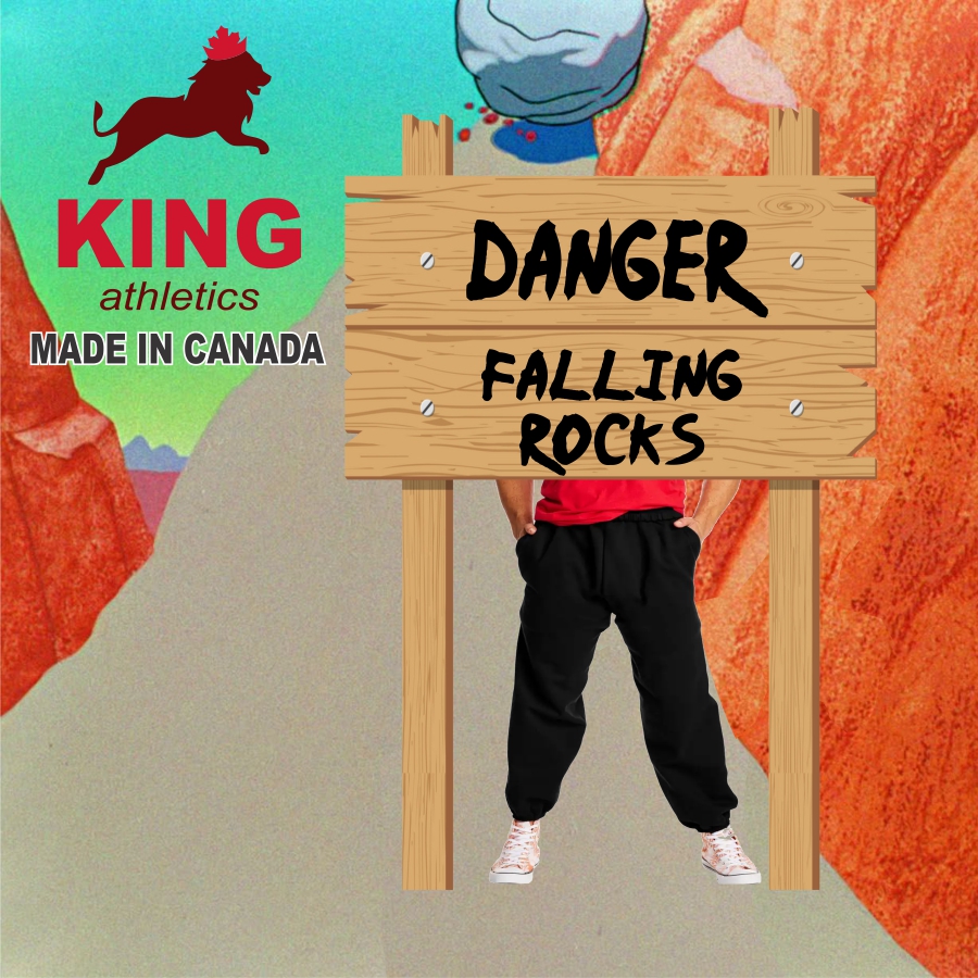 Wooden sign with the text 'DANGER FALLING ROCKS' in front of a person wearing black pants, red shirt, and white shoes, with a falling rock in the background and a King athletics logo with a red lion and 'MADE IN CANADA' text on the left side.