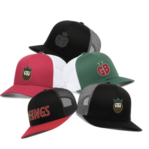 A collection of five stylish trucker hats featuring various designs, including a black hat with "GB" logo, a burgundy and white hat with a bearded king logo, a green hat with "GB" logo, and a black hat with "KINGS" text. Perfect for casual wear and showcasing personal style.